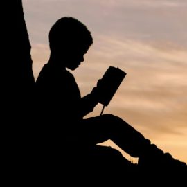 Child reading a Bible