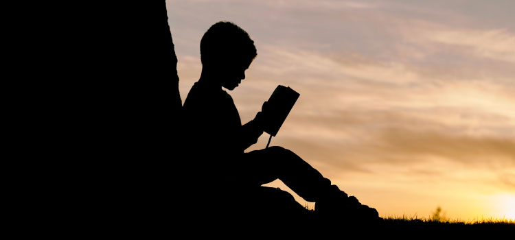 Child reading a Bible