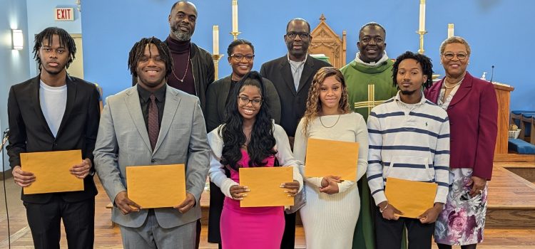 nativity scholarship recipients with envelopes in church