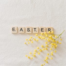 Easter spelled our in scrabble letters with yellow baby's breath flower stem
